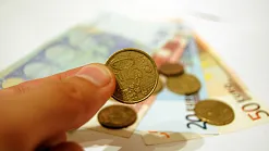 Hand holding a coin from 4freephotos.com