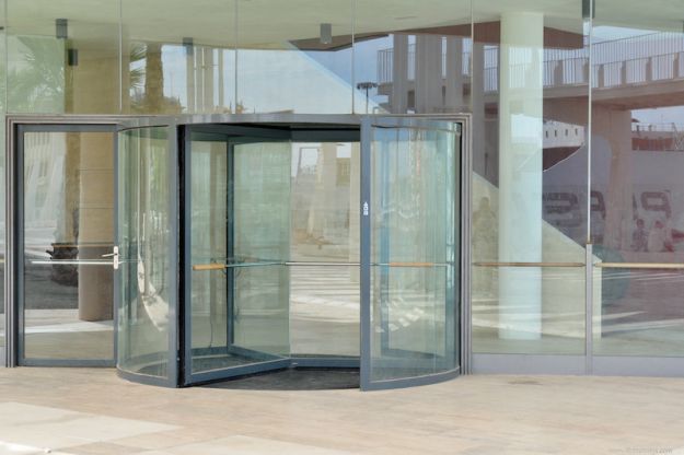 Revolving door in a office building from 4freephotos.com